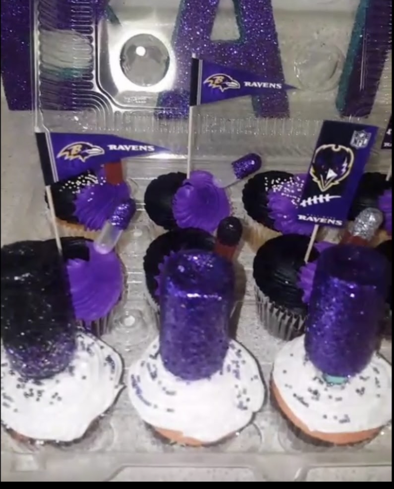 Baltimore Ravens themed cupcakes with purple glitter